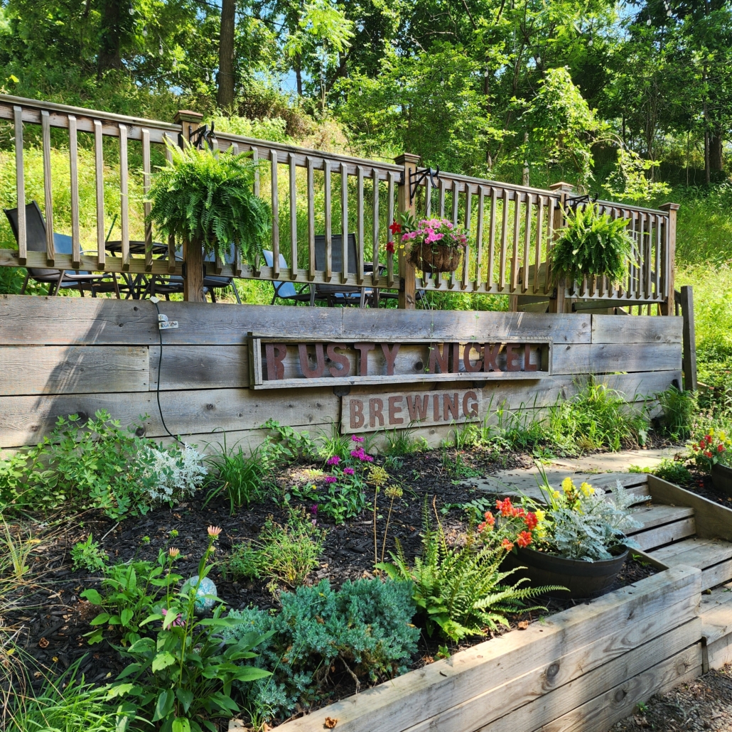Garden beds and stage at Rusty Nickel Brewing.