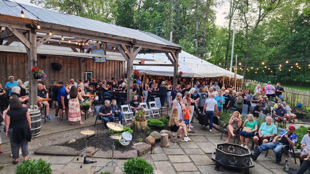 Guests fill the patio space during an event at Rusty Nickel Brewing