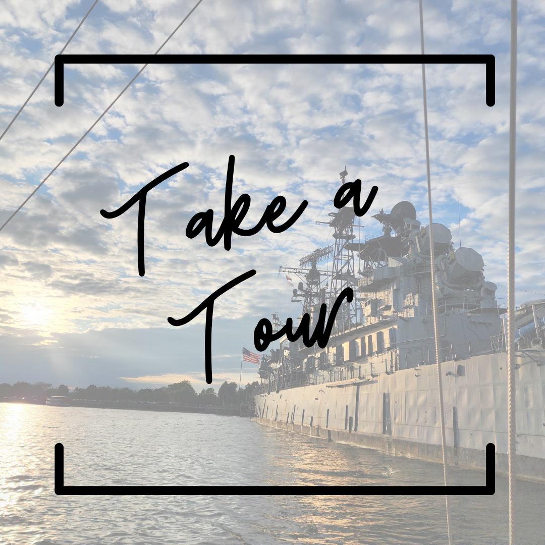 A photo of a naval ship docked in a canal. Text says "Take a Tour"