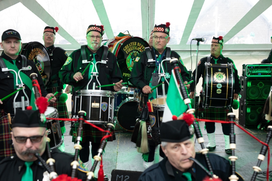 Band performing with drums and bagpipes
