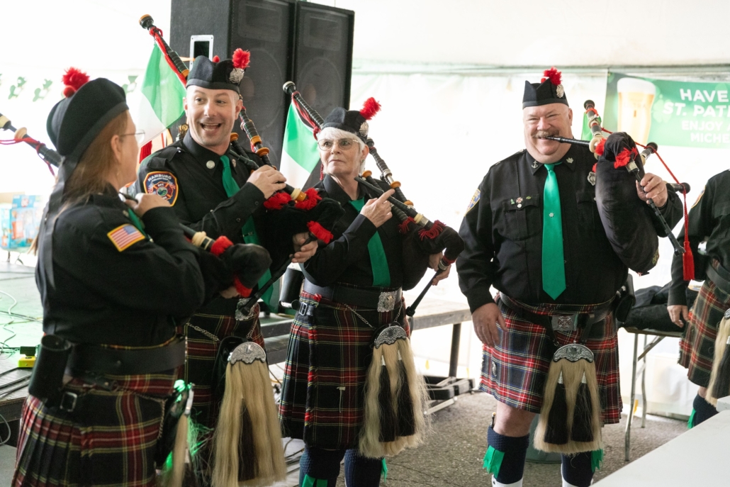 Bagpipers performing in traditional attire.